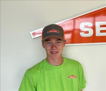 Man standing in front of servpro sign