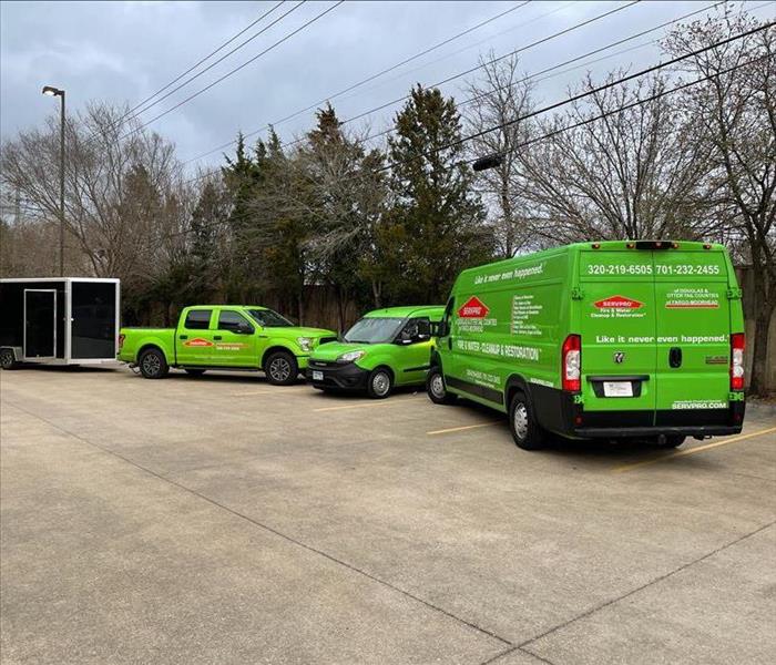 SERVPRO truck and vans parked outside. 
