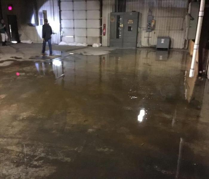 Concrete floor with standing water sitting. 