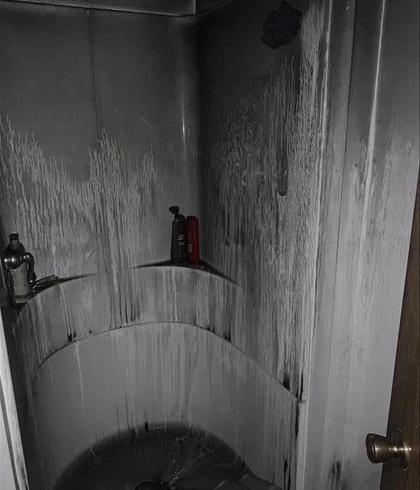 Shower covered in black soot in Fergus Falls. 