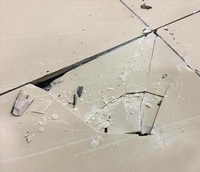 Cracked tile in a kitchen.